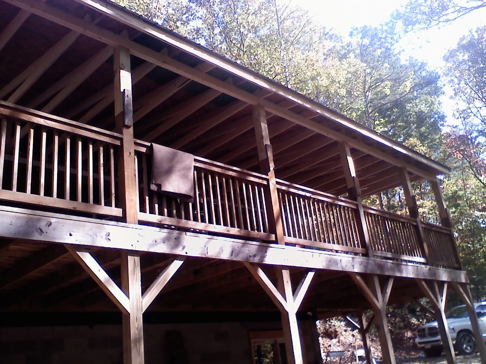 Timber framing under a new elevated porch and deck — Roof Leak Repair in Penn by Roofing Brothers